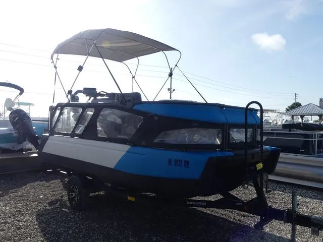 Slide: The Image of 2022 Sea-Doo Switch Cruise 18 boat on trailer, blue and black, outdoors. - 3