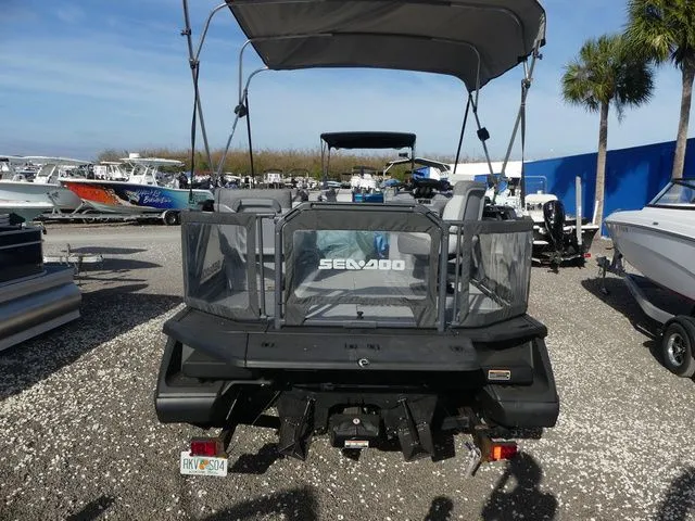 Slide: The Image of Rear view of 2022 Sea-Doo Switch® Cruise 18 - 100 hp boat at marina. - 5