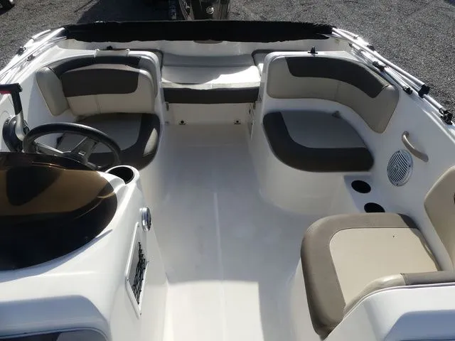 Slide: The Image of Interior of a 2017 Bayliner Element E16 boat with seating. - 13