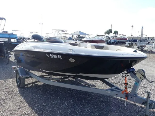 Slide: The Image of 2017 Bayliner Element E16 boat on trailer outdoors. - 3