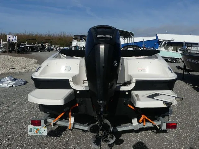 Slide: The Image of Rear view of a 2017 Bayliner Element E16 boat on a trailer. - 5