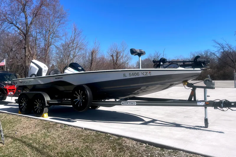 Slide: The Image of 2020 Vexus AVX 2080 boat on trailer, parked outdoors under clear blue sky. - 3