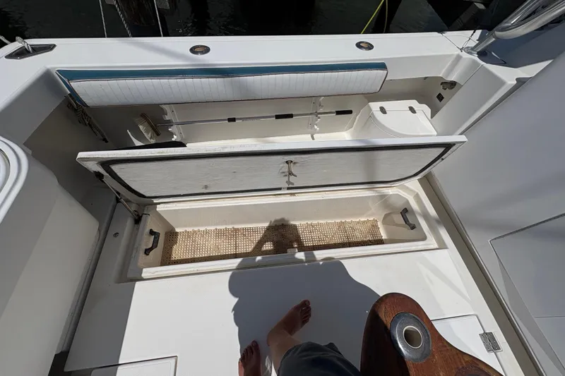 Slide: The Image of Open storage compartment on 2006 Rampage 38 Express boat deck. - 15