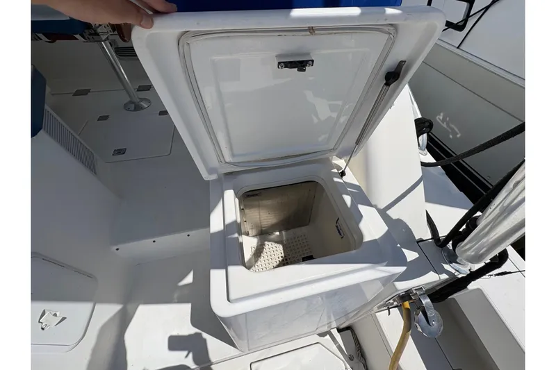 Slide: The Image of Open storage compartment on 2006 Rampage 38 Express boat deck. - 17