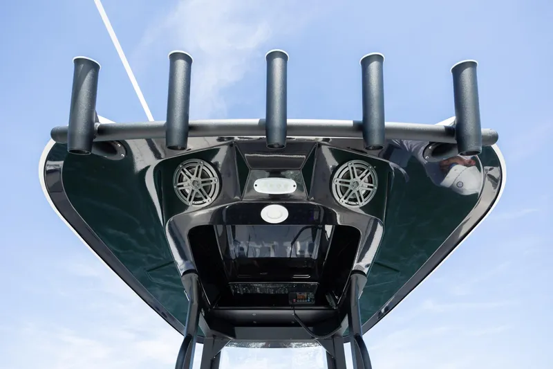 Slide: The Image of 2023 Yamaha Boats 255 FSH Sport E T-top with rod holders and speakers. - 21