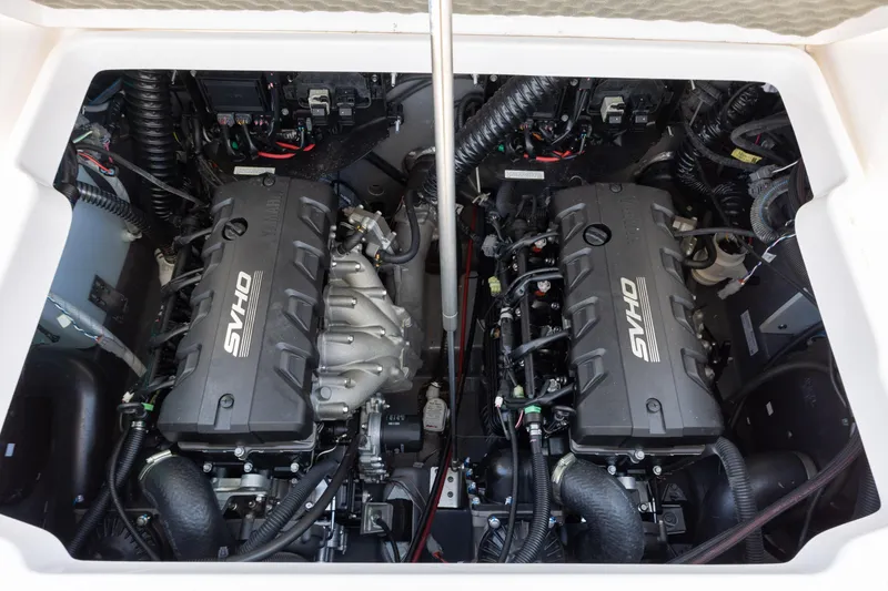 Slide: The Image of 2023 Yamaha Boats 255 FSH Sport E engine compartment with dual SVHO engines. - 22