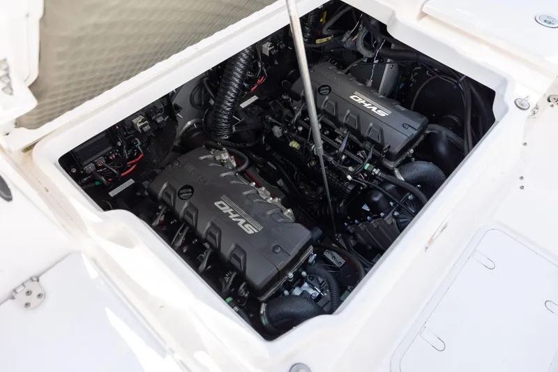 Slide: The Image of Engine compartment of 2023 Yamaha Boats 255 FSH Sport E, showcasing dual engines. - 23