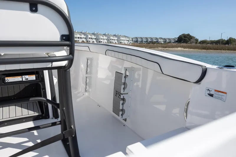 Slide: The Image of 2023 Yamaha Boats 255 FSH Sport E interior, showcasing sleek design and spacious seating. - 34