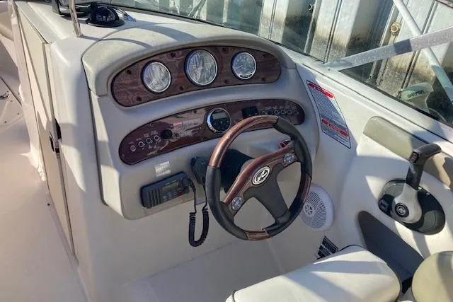 Slide: The Image of 2006 Sea Ray 270 Sundeck dashboard with steering wheel and instrument panel. - 4