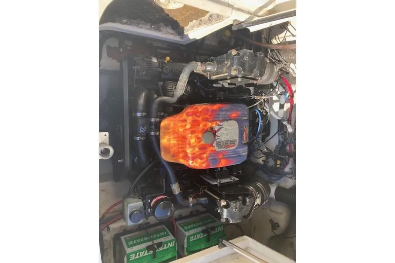 Slide: The Image of Engine of a 2006 Sea Ray 270 Sundeck with flame design cover. - 6