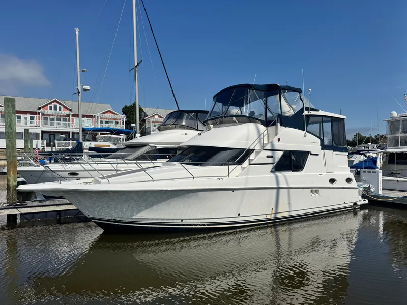 The Image of 2000 Silverton 392 Motor Yacht docked on a sunny day. - 0