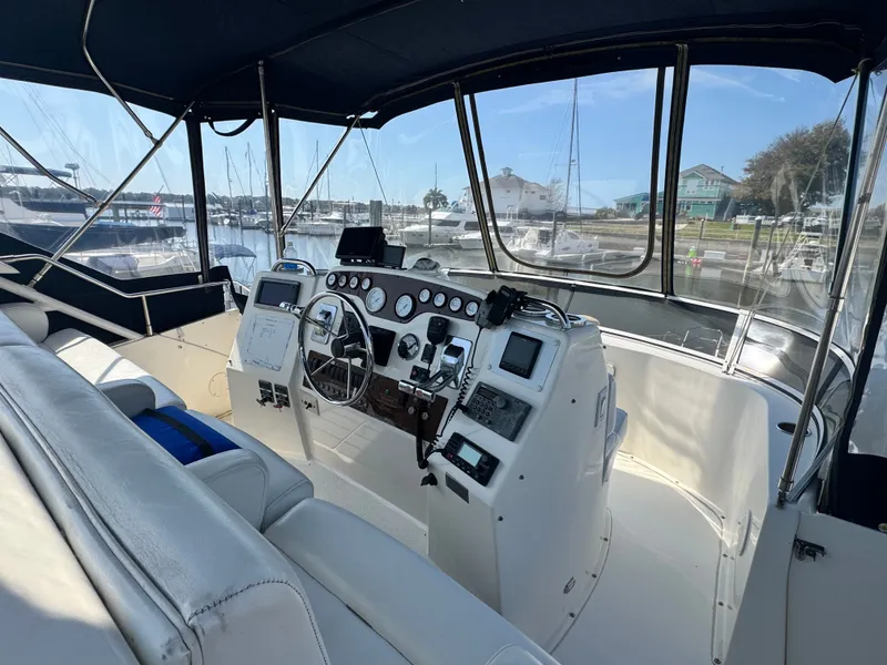 Slide: The Image of Interior view of 2000 Silverton 392 Motor Yacht at the marina. - 10