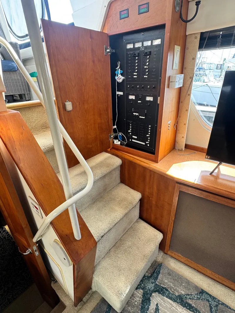 Slide: The Image of Interior of 2000 Silverton 392 Motor Yacht with stairs and control panel. - 17