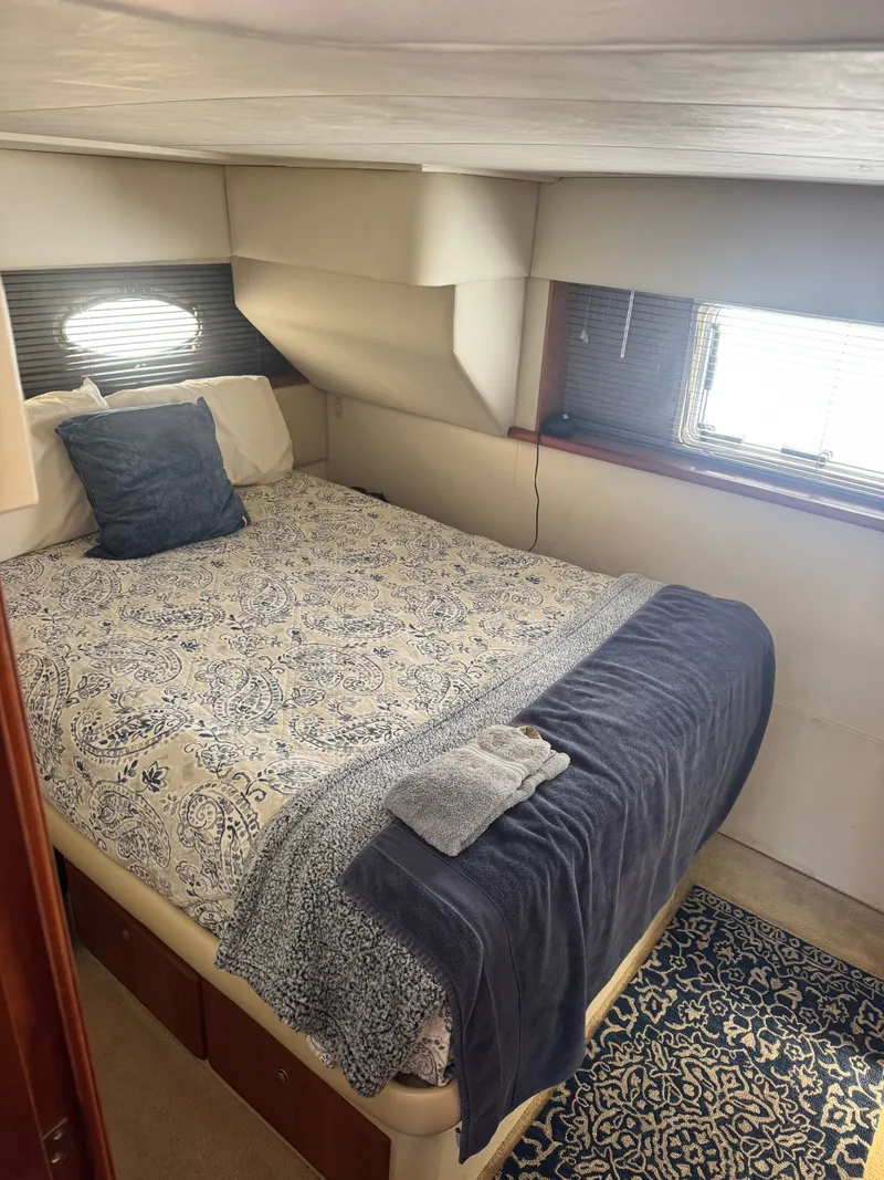 Slide: The Image of Interior of 2000 Silverton 392 Motor Yacht, cozy bedroom. - 19