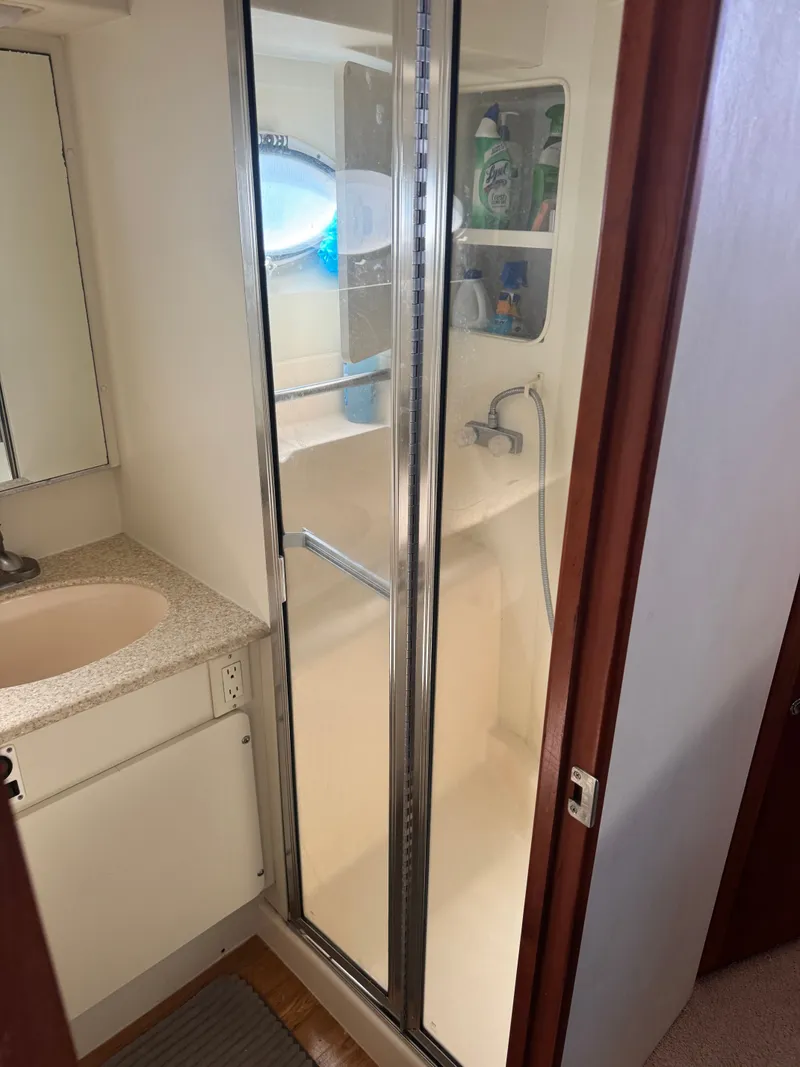 Slide: The Image of Silverton 392 Motor Yacht 2000 bathroom with shower and sink. - 20