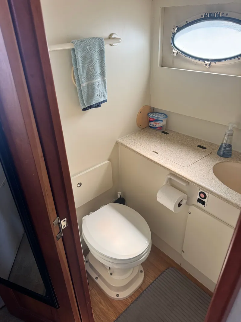 Slide: The Image of Silverton 392 Motor Yacht 2000 bathroom with toilet and sink. - 21