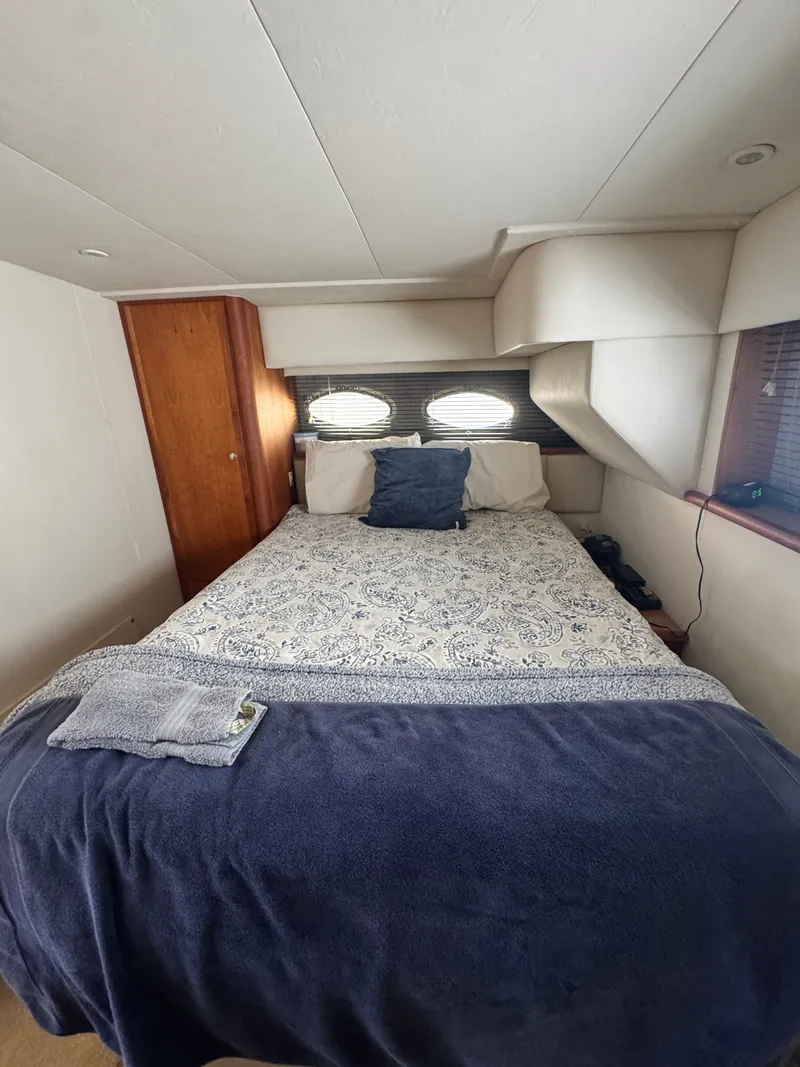 Slide: The Image of Interior cabin of 2000 Silverton 392 Motor Yacht with bed. - 22