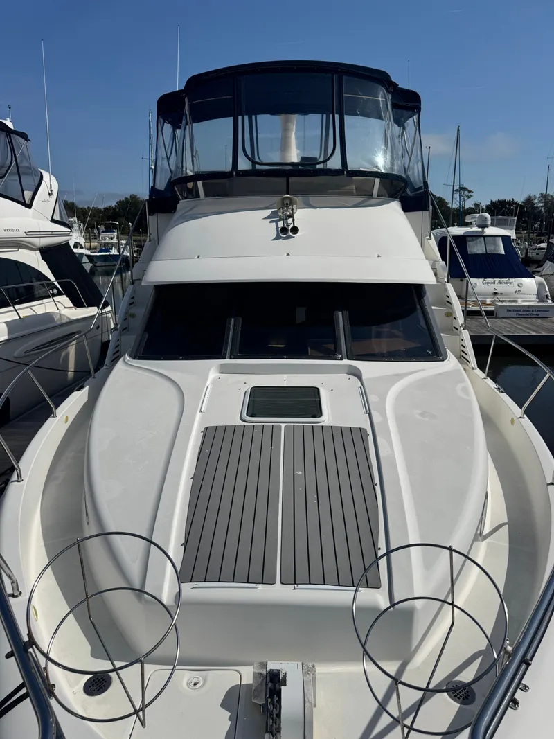 Slide: The Image of 2000 Silverton 392 Motor Yacht docked, front view. - 3