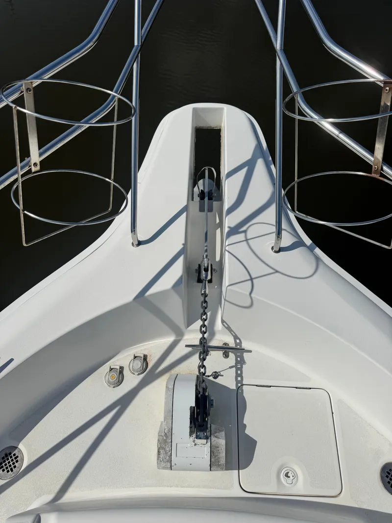 Slide: The Image of Bow of 2000 Silverton 392 Motor Yacht with anchor windlass. - 8