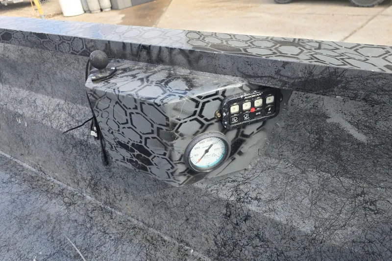 Slide: The Image of Control panel with gauge and buttons on custom Rene Gros 2022 model, featuring unique pattern design. - 13