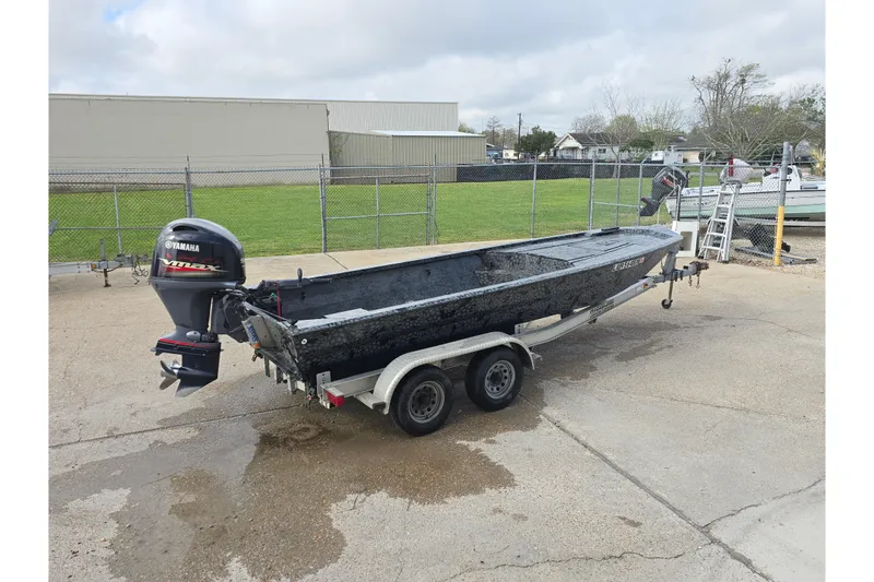 Slide: The Image of Custom Rene Gros 2022 boat on trailer with Yamaha VMAX outboard motor. - 2