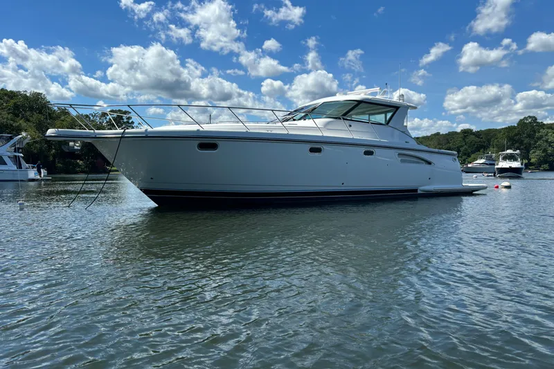 The Image of 2005 Tiara Yachts 4400 Sovran on calm water under a blue sky. - 0