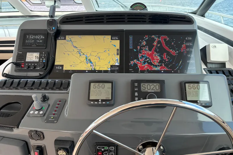 Slide: The Image of Helm of 2005 Tiara Yachts 4400 Sovran with navigation and communication equipment. - 11