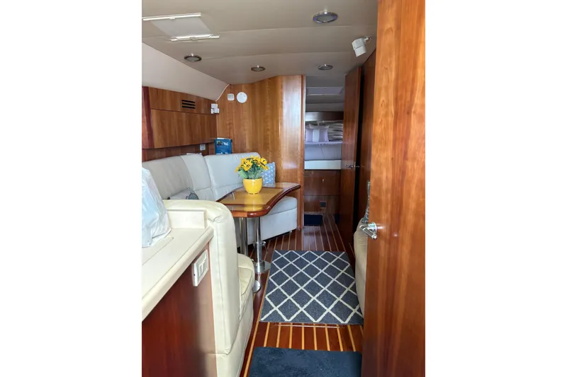 Slide: The Image of Luxurious interior of 2005 Tiara Yachts 4400 Sovran with elegant wood finishes. - 13