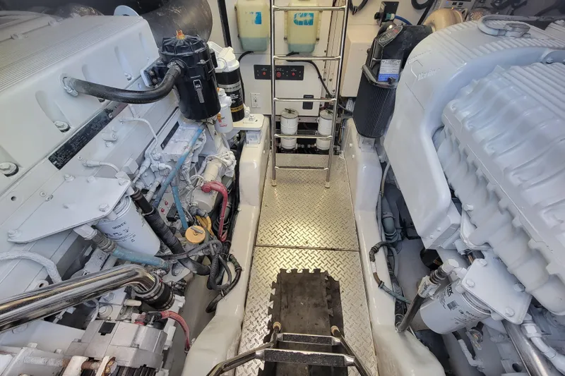 Slide: The Image of Engine room of a 2005 Tiara Yachts 4400 Sovran, showcasing dual engines and equipment. - 20