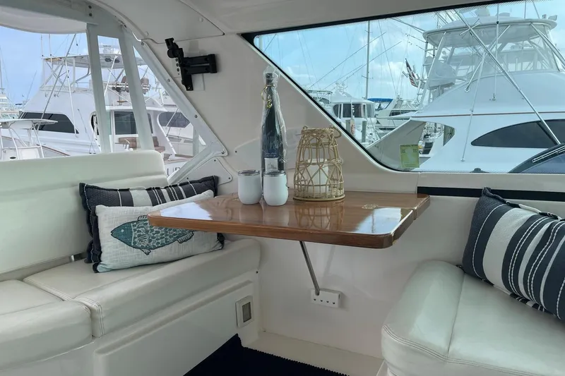 Slide: The Image of Interior of 2005 Tiara Yachts 4400 Sovran with elegant seating and decorative pillows. - 8