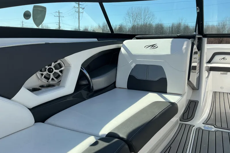 Slide: The Image of Interior of a 2018 Monterey 224FS boat with sleek seating and speaker system. - 11
