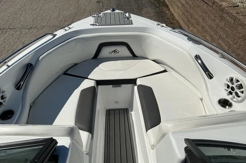 Slide: The Image of 2018 Monterey 224FS boat interior with white seating and sleek design. - 12