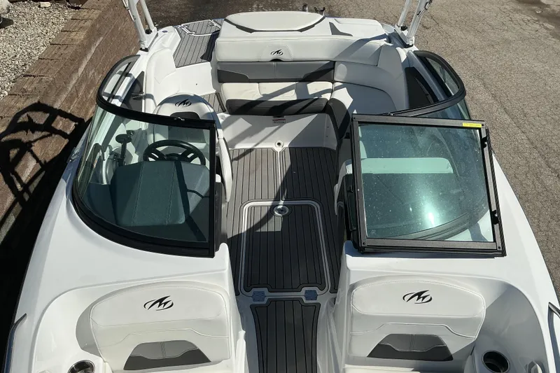 Slide: The Image of 2018 Monterey 224FS boat interior with seating and steering wheel, featuring sleek design. - 13