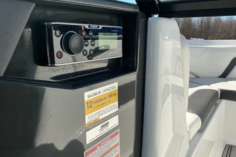 Slide: The Image of Interior of 2018 Monterey 224FS boat with Fusion stereo and capacity label. - 15