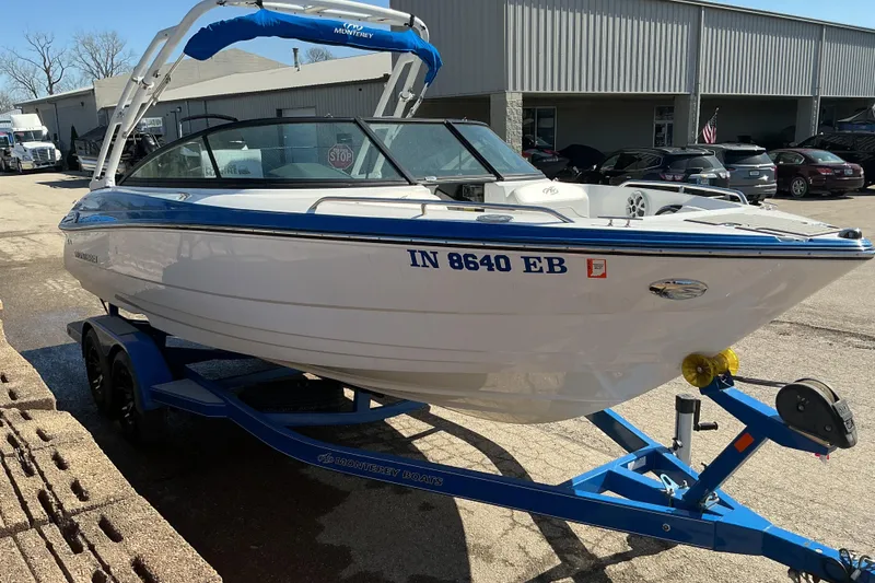 Slide: The Image of 2018 Monterey 224FS boat on trailer, parked outside dealership. - 3