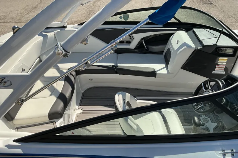 Slide: The Image of 2018 Monterey 224FS boat interior with sleek seating and modern dashboard design. - 5