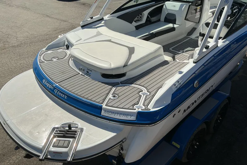 Slide: The Image of 2018 Monterey 224FS boat with sleek design and comfortable seating on display. - 6