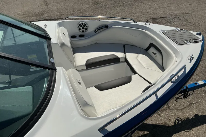 Slide: The Image of 2018 Monterey 224FS boat interior with cushioned seating and speaker system. - 7