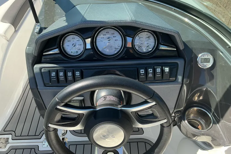 Slide: The Image of 2018 Monterey 224FS boat dashboard with gauges and steering wheel. - 8