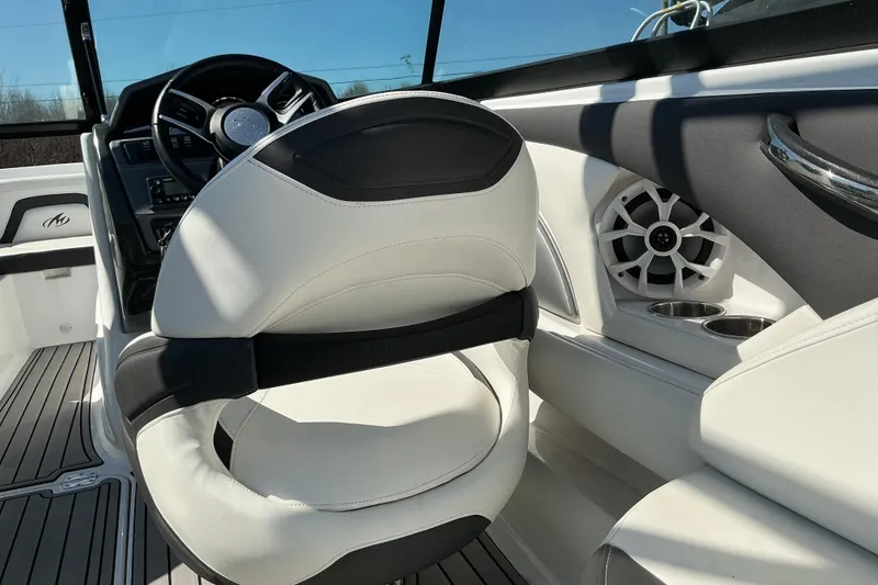 Slide: The Image of 2018 Monterey 224FS boat interior with white seating and speaker system. - 9