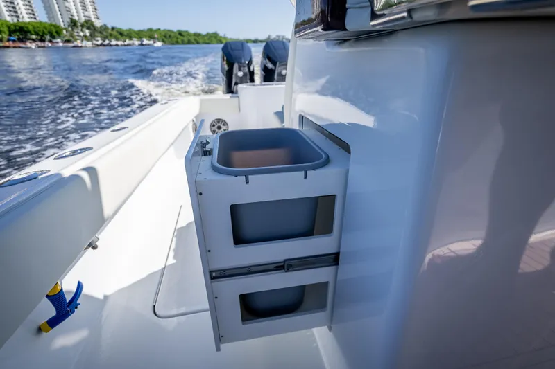 Slide: The Image of 2027 Billfish 39 boat with storage compartments, cruising on a sunny day. - 10