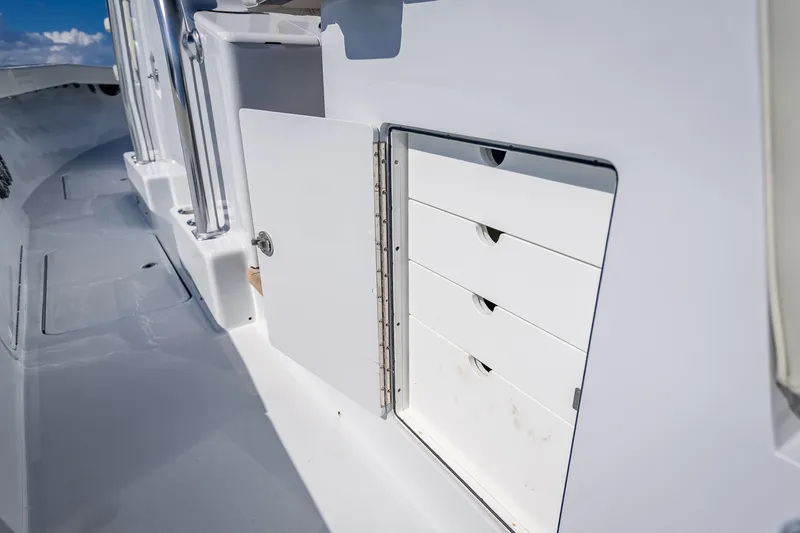 Slide: The Image of Open storage compartment on 2027 Billfish 39 boat deck, showcasing organized drawers. - 11
