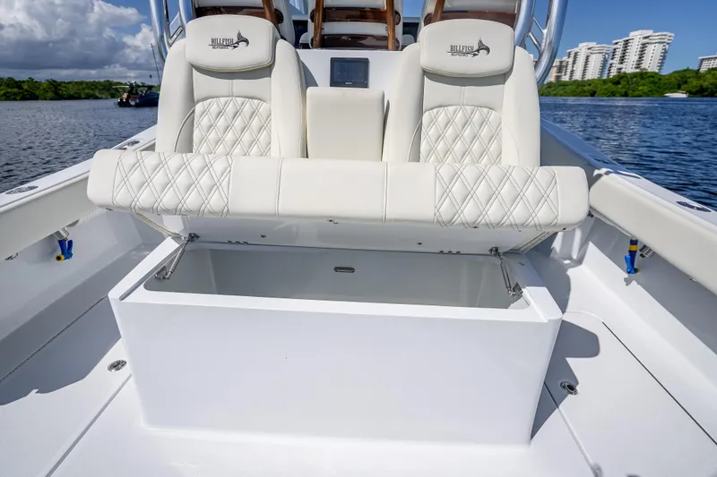 Slide: The Image of Luxurious seating on 2027 Billfish 39 boat, featuring diamond-stitched upholstery and storage compartment. - 5