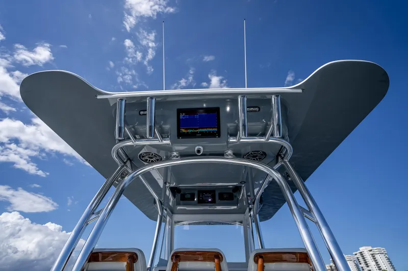 Slide: The Image of 2027 Billfish 39 boat console with advanced navigation system under clear blue sky. - 6