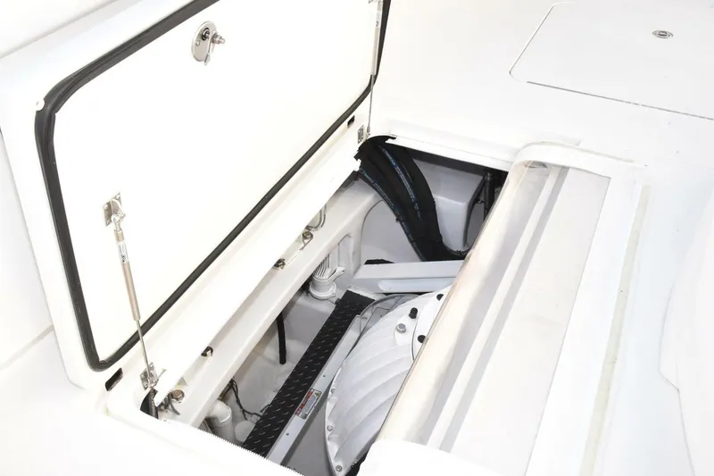 Slide: The Image of Open hatch of 2019 Viking 80 Sky Bridge yacht, revealing interior components. - 101