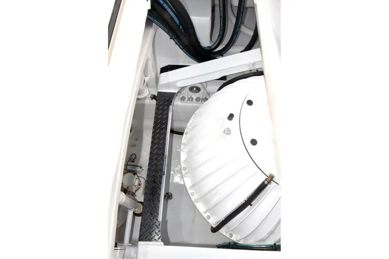 Slide: The Image of Engine compartment of 2019 Viking 80 Sky Bridge yacht, showcasing mechanical components and wiring. - 102