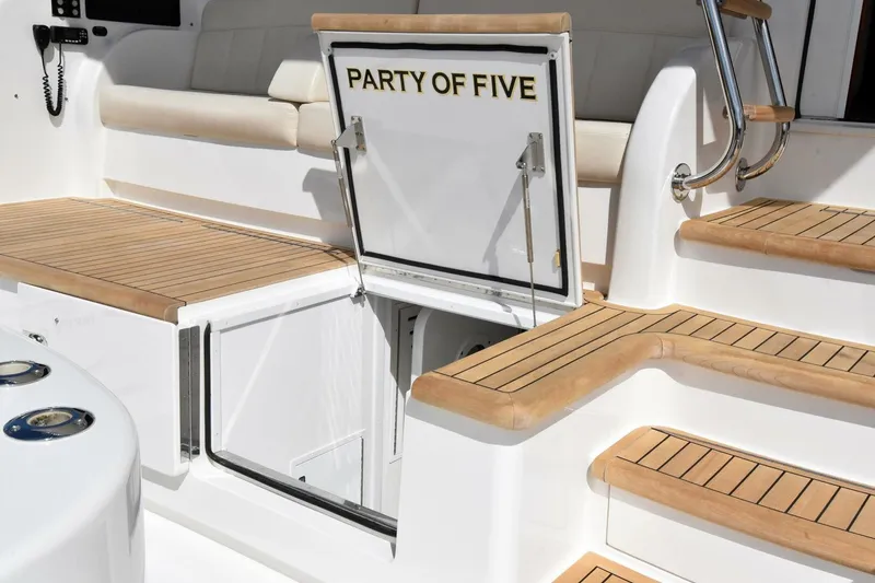 Slide: The Image of 2019 Viking 80 Sky Bridge yacht with teak steps and "Party of Five" hatch. - 105