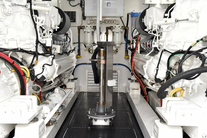 Slide: The Image of Engine room of 2019 Viking 80 Sky Bridge yacht, showcasing advanced machinery and wiring. - 108