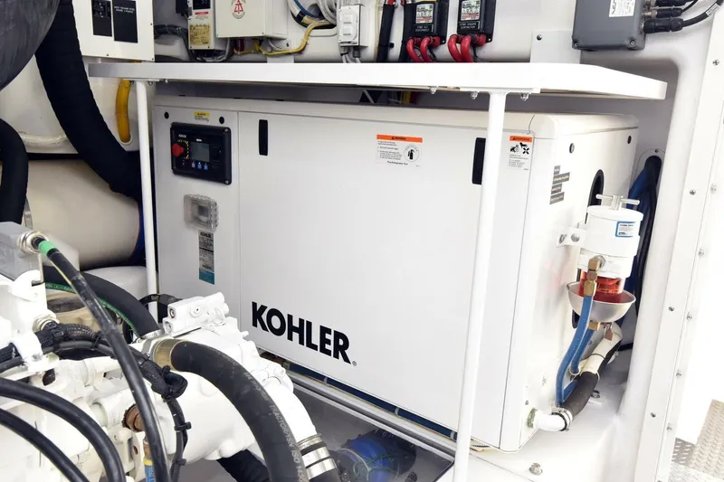 Slide: The Image of Engine room of 2019 Viking 80 Sky Bridge with Kohler generator. - 111