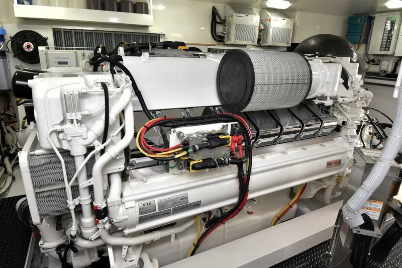 Slide: The Image of Engine room of 2019 Viking 80 Sky Bridge yacht, featuring advanced machinery and components. - 112
